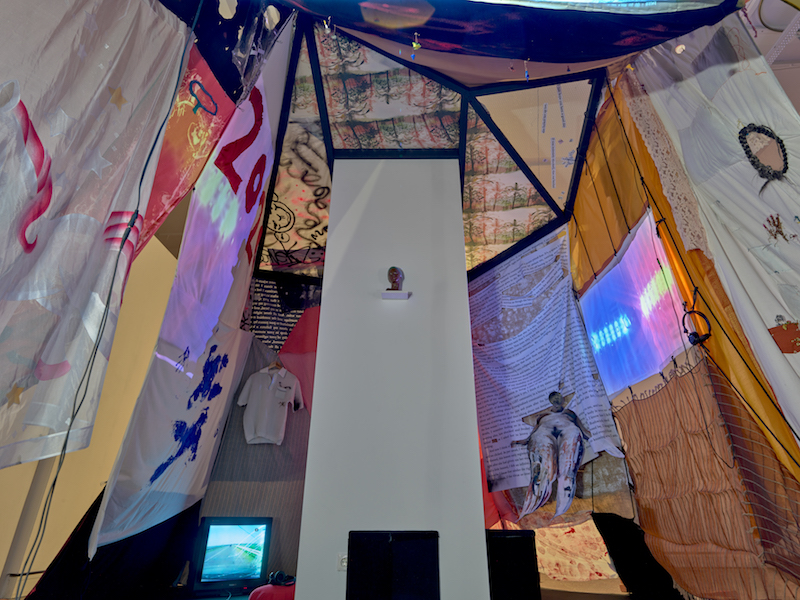 The inside of the blanket fort with a view of a TV