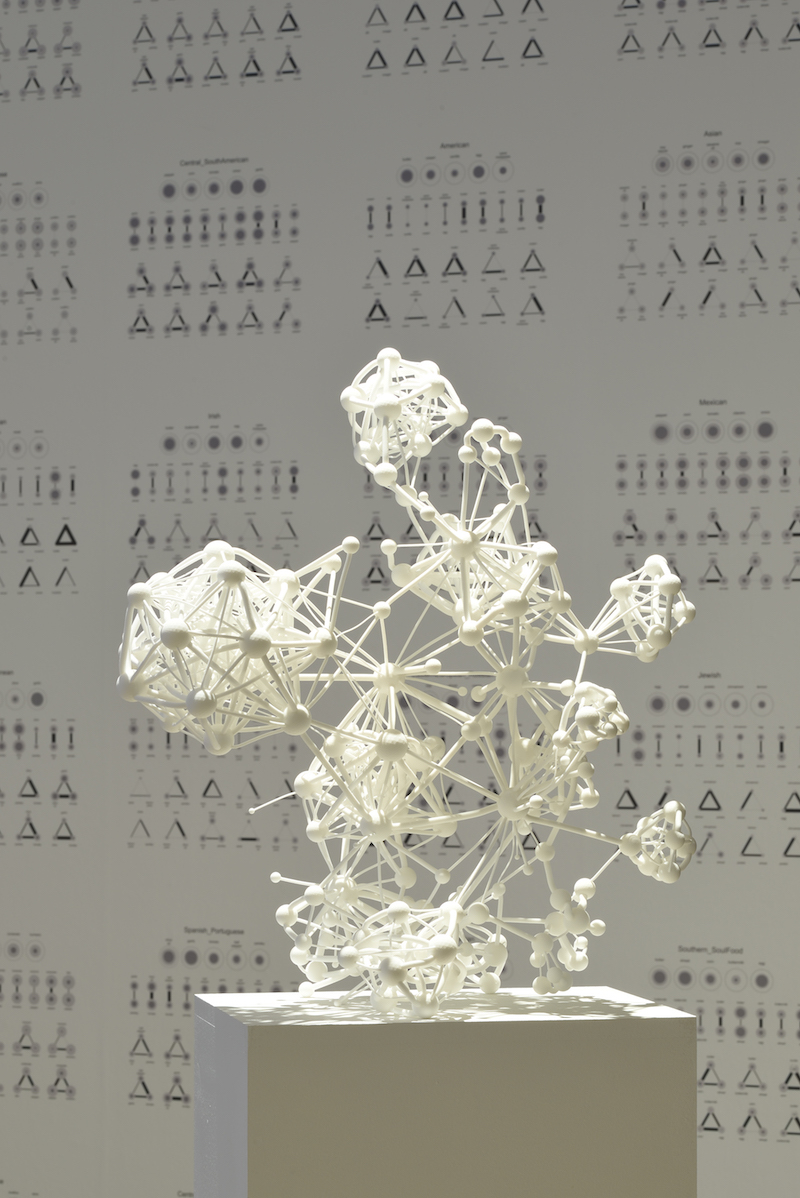 a white 3d sculpture of visualized data in the form of small clusters attached to nodes, standing on a pedestal