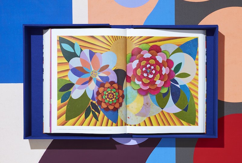 a spread from inside Beatriz Milhazes monograph, showing a graphic, colorful print of flowers