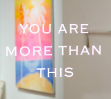 The words "you are more than this" written on a mirror