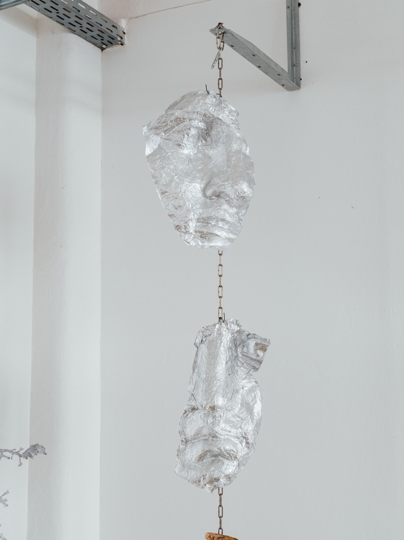 Close up of a hanging sculpture made from aluminium casts