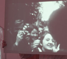 video still from Else Rosenfeld's 'Hugging Angela Davis' featuring black and white footage of a crowd
