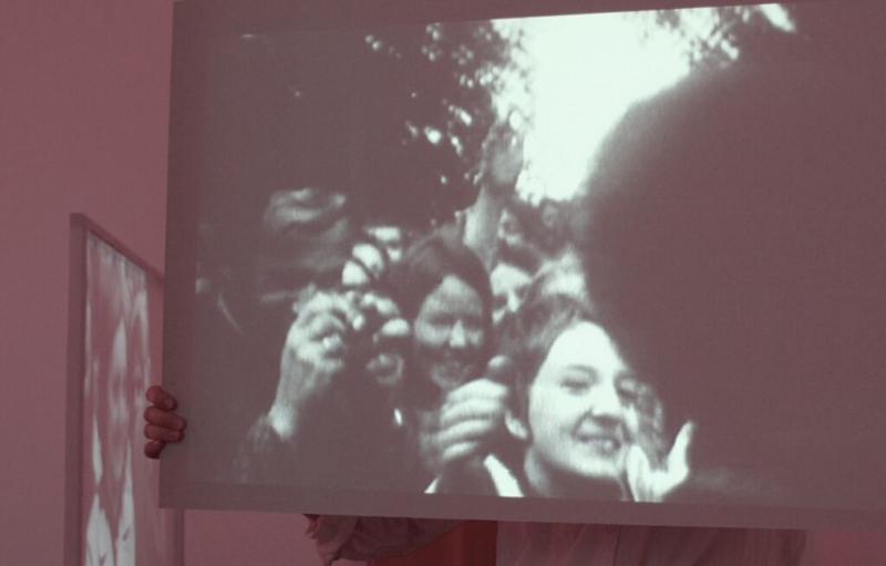 video still from Else Rosenfeld's 'Hugging Angela Davis' featuring black and white footage of a crowd