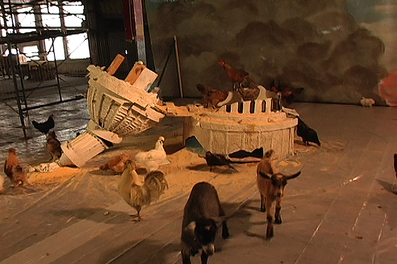 Farm animals circle a destroyed model of the Capitol in Washington
