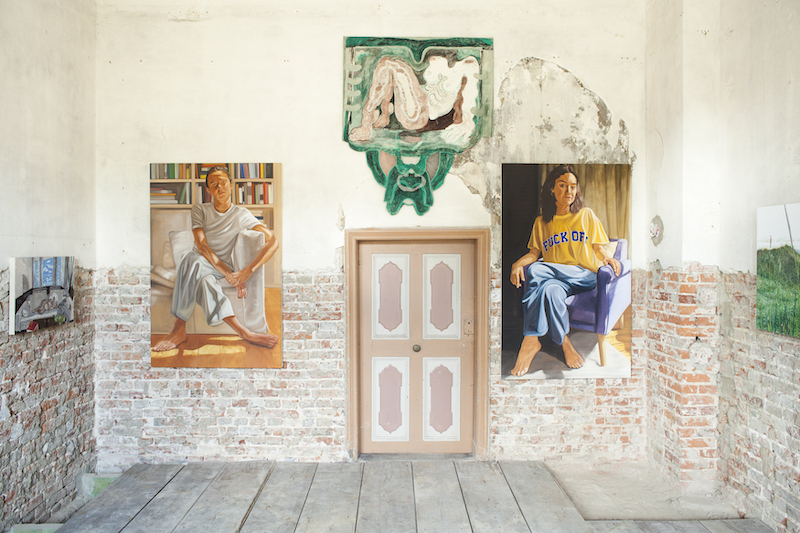 paintings hung up in a historical manor house