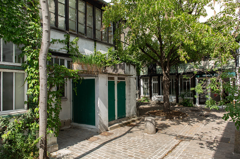 The entrance of a villa on a summer street in France