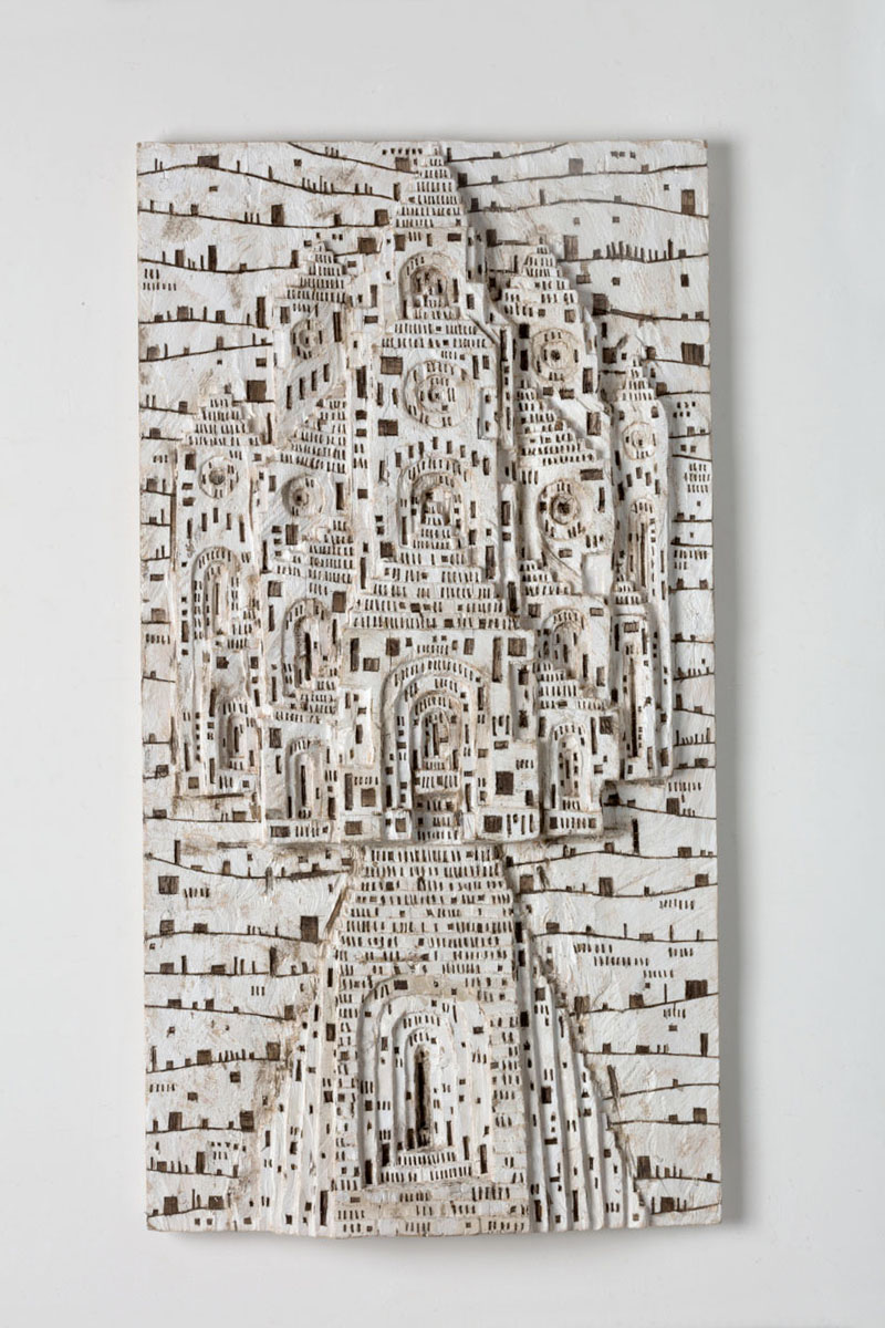 The form of a cathedral cut into wood painted white