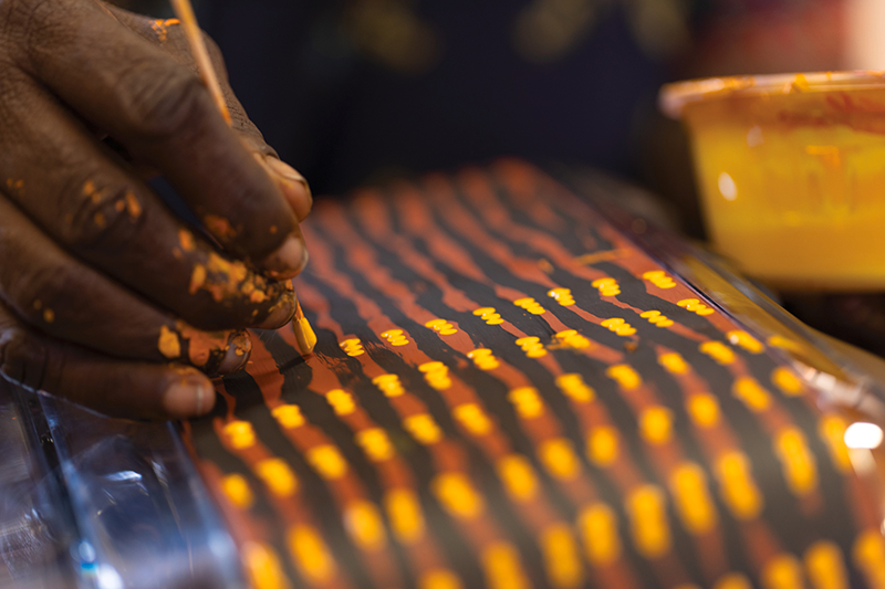 close-up of a hand painting on a toaster