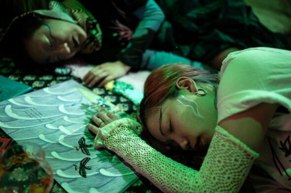 Close up picture of two girls sleeping next to each other