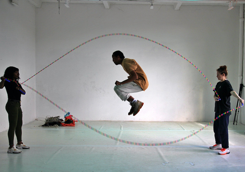 A man jumping rope, playing the game Double Dutch