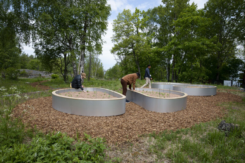 three closed garden structures in the nature